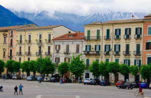 Abruzzo Private Italy Tours of Piazza Garibaldi Sulmona in spring surrounded by snow-capped mountains